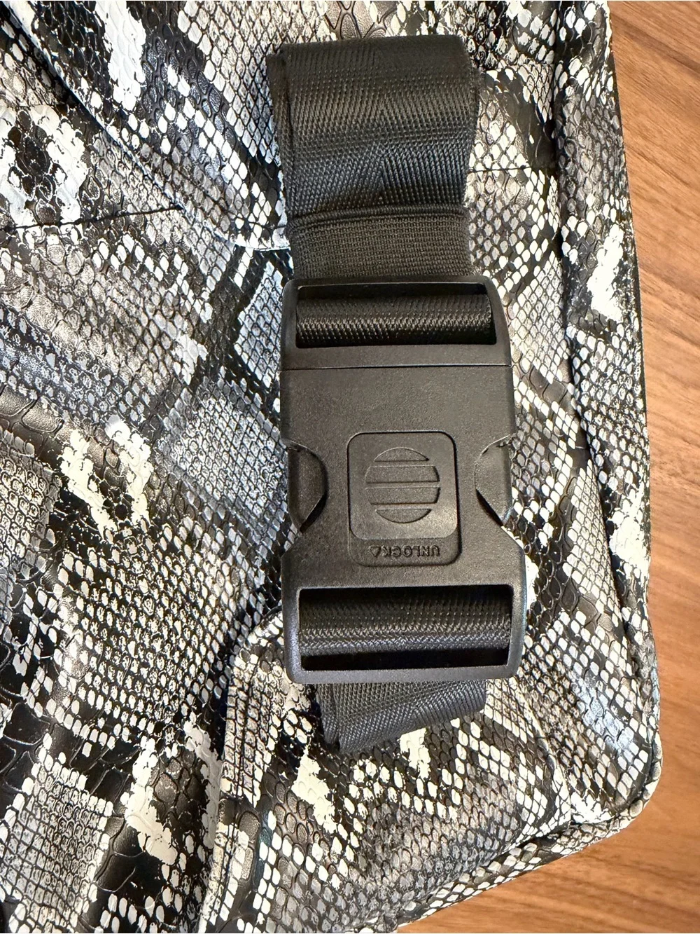 Tushbaby The Pack Snake Print Crossbody Baby Bag in Black & Gray